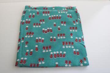 catalog photo of vintage cotton feedsack fabric, abstract people print jade green w/ red & white