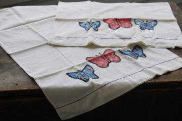 photo of vintage cotton flour sack pillowcases w/ hand stitched embroidered applique butterflies