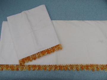 catalog photo of vintage cotton pillowcases w/ tatting, wide tatted lace in oranges