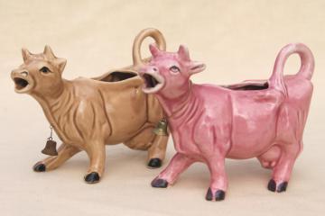 catalog photo of vintage cow cream pitchers, brown cow & pink cow creamers w/ bells, ceramic cows made in Japan