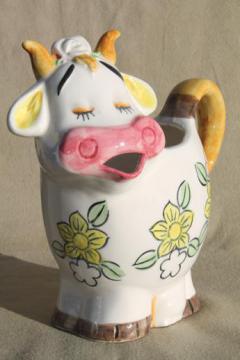 catalog photo of vintage cow shaped milk pitcher, shy smiling cow w/ flower power daisies!