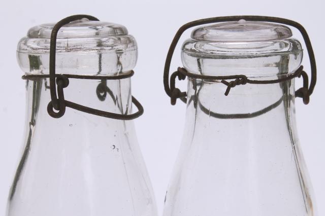 photo of vintage cream or milk bottles, old half-pint bottle w/ wire bail glass lids #2