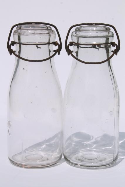 photo of vintage cream or milk bottles, old half-pint bottle w/ wire bail glass lids #3