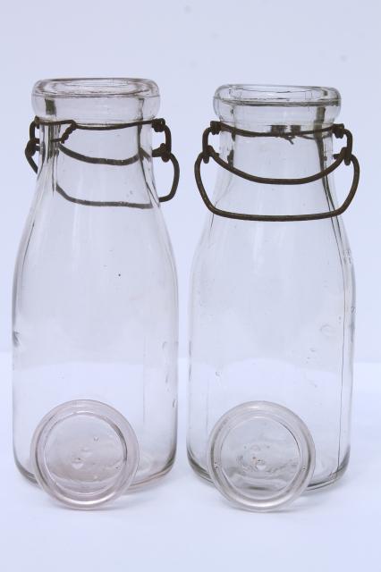 photo of vintage cream or milk bottles, old half-pint bottle w/ wire bail glass lids #5