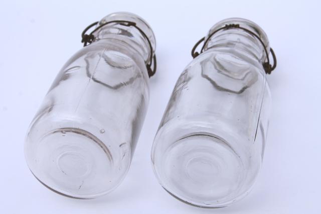 photo of vintage cream or milk bottles, old half-pint bottle w/ wire bail glass lids #9