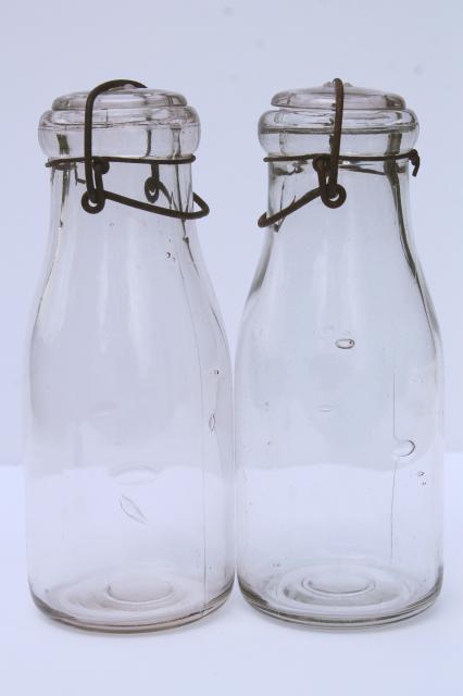 photo of vintage cream or milk bottles, old half-pint bottle w/ wire bail glass lids #10