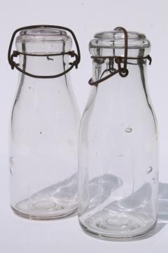 catalog photo of vintage cream or milk bottles, old half-pint bottle w/ wire bail glass lids