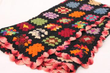 catalog photo of vintage crocheted wool afghan blanket, black w/ bright colors granny squares crochet
