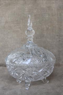 catalog photo of vintage crystal clear glass candy dish, pinwheel pattern three toed bowl w/ lid