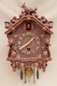 catalog photo of vintage cuckoo clock Lux / Waterbury wind-up clock black forest fairy tale cottage