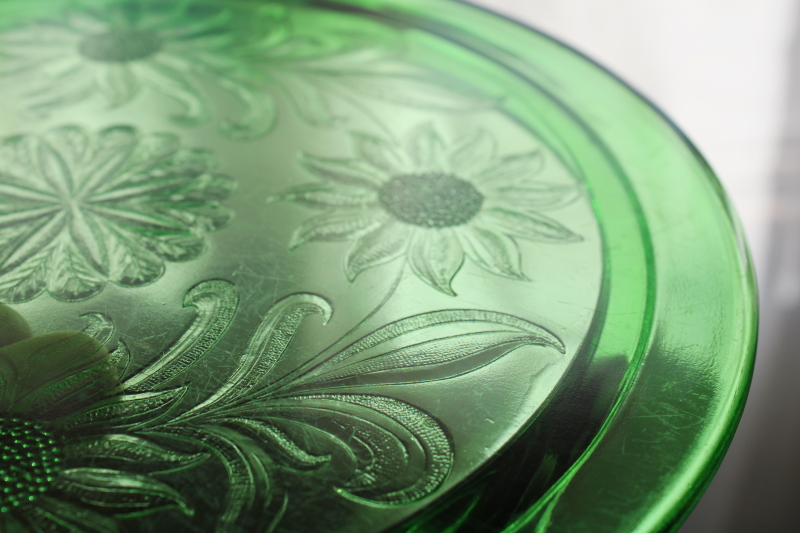 photo of vintage depression glass cake plate, Jeannette sunflower pattern deep green glass with uranium glow  #4