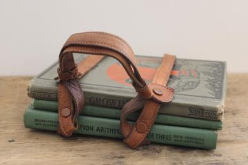 catalog photo of vintage early reader school books w/ green covers in old antique leather strap satchel