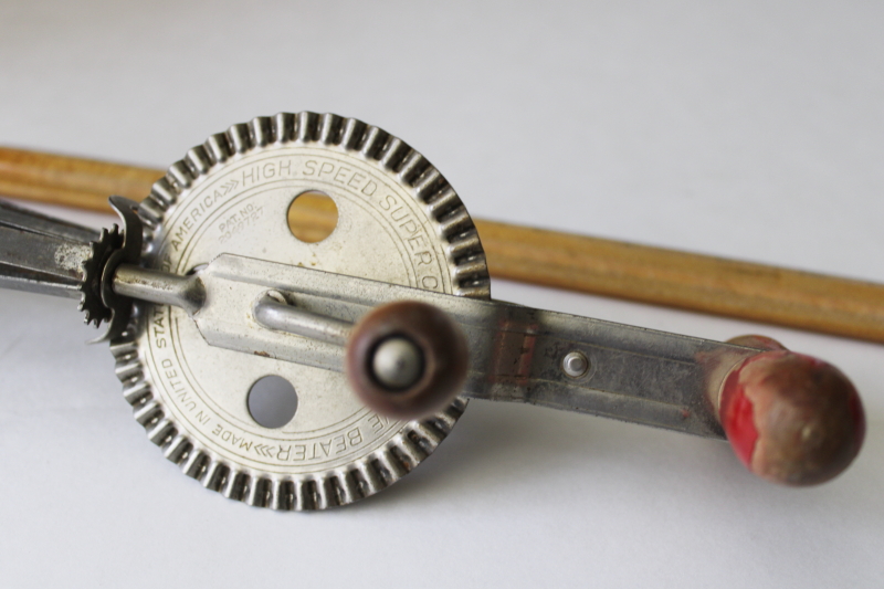 photo of vintage eggbeater, hand crank rotary mixer w/ old red paint wood handle #4