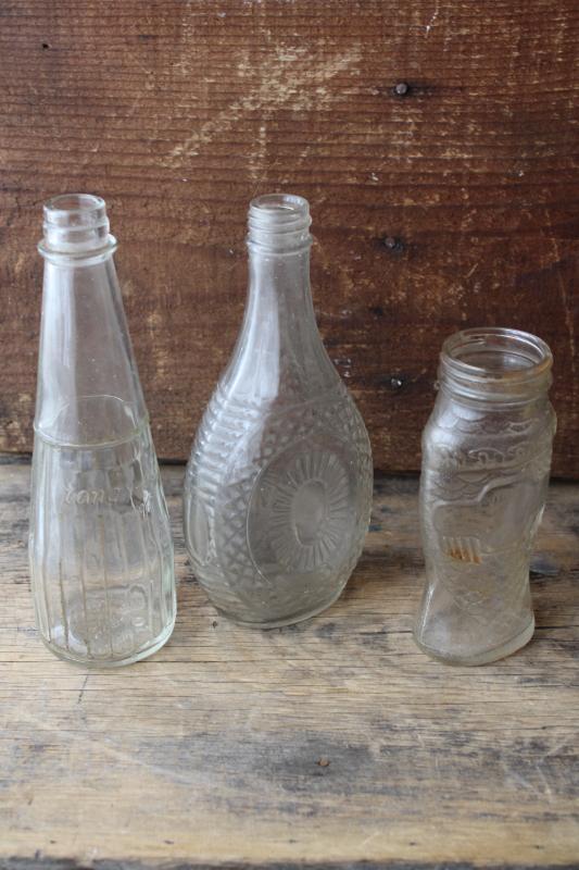 photo of vintage embossed glass bottles, condiment sauce jars, old dug bottle collection #1