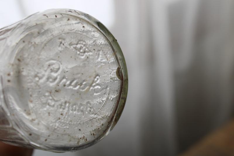 photo of vintage embossed glass bottles, condiment sauce jars, old dug bottle collection #2