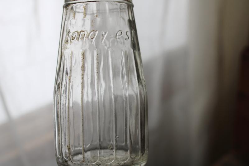 photo of vintage embossed glass bottles, condiment sauce jars, old dug bottle collection #3