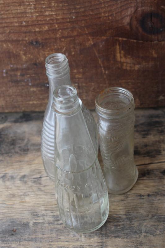 photo of vintage embossed glass bottles, condiment sauce jars, old dug bottle collection #4