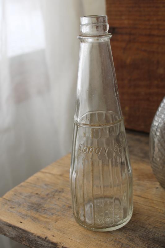 photo of vintage embossed glass bottles, condiment sauce jars, old dug bottle collection #5