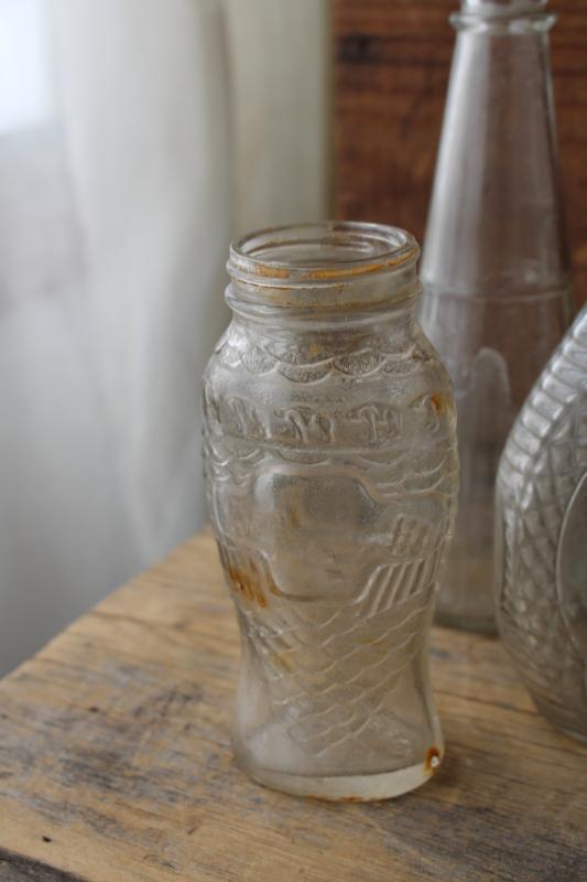 photo of vintage embossed glass bottles, condiment sauce jars, old dug bottle collection #7