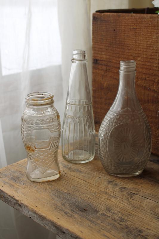 photo of vintage embossed glass bottles, condiment sauce jars, old dug bottle collection #8
