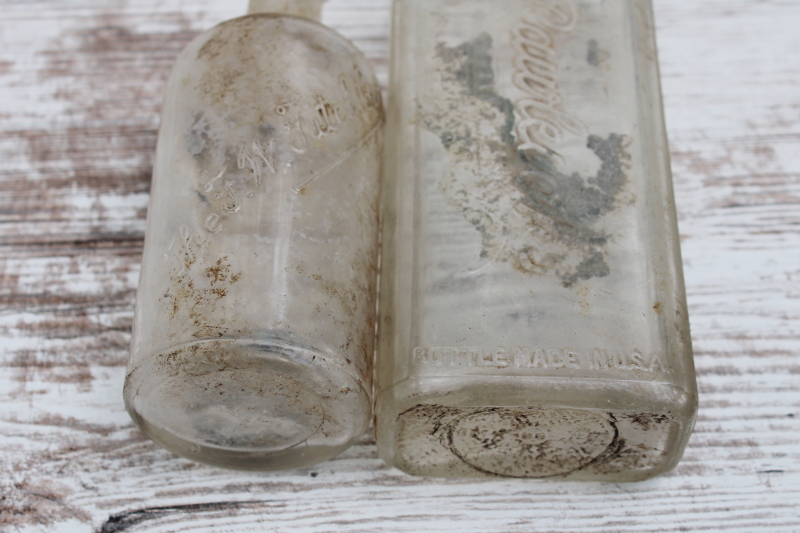 photo of vintage embossed glass medicine bottles, spooky old dug bottles for creepy haunted Halloween #7
