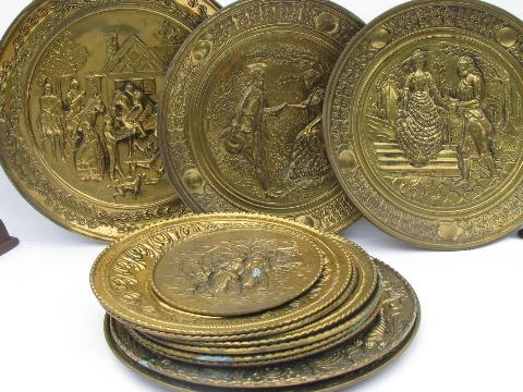 photo of vintage embossed solid brass chargers, large plates or trays, Old English scenes #1