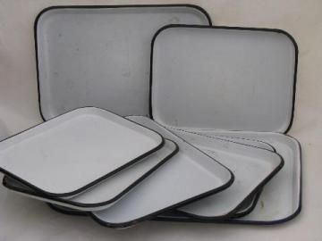 catalog photo of vintage enamelware trays in three different sizes, white w/ black