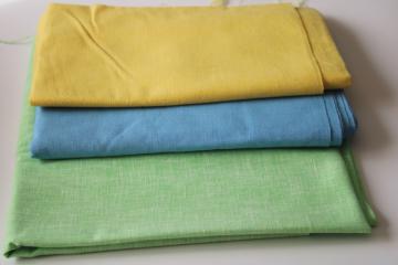 catalog photo of vintage fabric lot, linen weave cotton and blends, spring solids sky blue, yellow, pistachio green