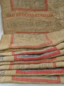 catalog photo of vintage farm primitive burlap feed bags w/ advertising graphics, lot 8 sacks