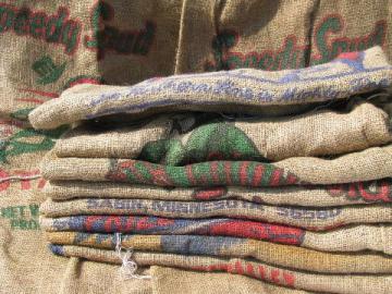 catalog photo of vintage farm primitive burlap potato bags w/ bright advertising graphics, 50 lb sacks