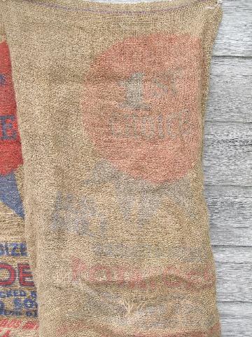 photo of vintage farm primitive burlap potato bags w/ bright advertising graphics #2