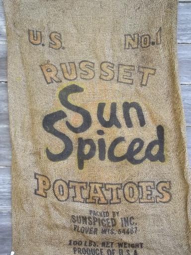 photo of vintage farm primitive burlap potato bags w/ bright advertising graphics #5