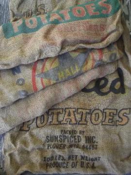 catalog photo of vintage farm primitive burlap potato bags w/ bright advertising graphics