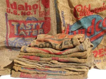 catalog photo of vintage farm primitive burlap potato bags w/ bright advertising graphics, lot of 9 sacks