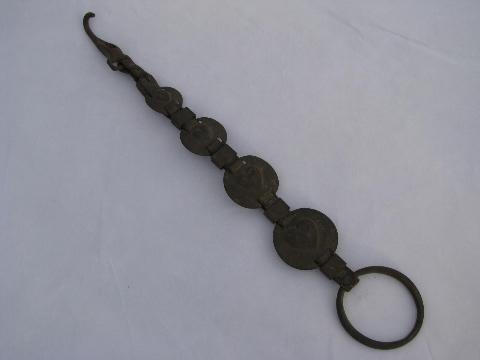 photo of vintage farm primitive hook, old heart horse brasses, antique brass medallions on strap #1