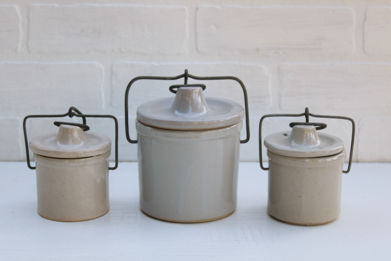 photo of vintage farmhouse decor, old white stoneware crock jars, cheese crocks w/ wire bails and lids #1