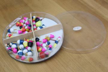 catalog photo of vintage fishing tackle, unused mini fishing bobbers floats in neon colors