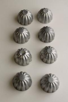 catalog photo of vintage fluted shape food molds or baking tins, shabby old molds for upcycle crafting