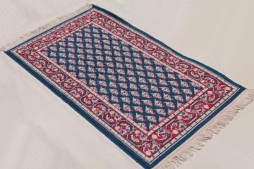 catalog photo of vintage fringed wool area rug, small oriental carpet woven red & white on navy blu
