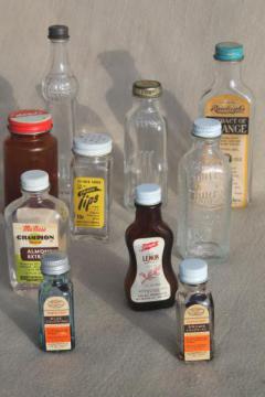 catalog photo of vintage glass bottles lot, kitchen spice bottle / extracts & flavoring bottles