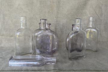 catalog photo of vintage glass bottles w/ old sun purple color, antique flasks pocket liquor bottle lot