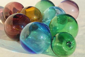 catalog photo of vintage glass fishing net floats, hand blown glass balls, blue green amber amethyst colored glass 