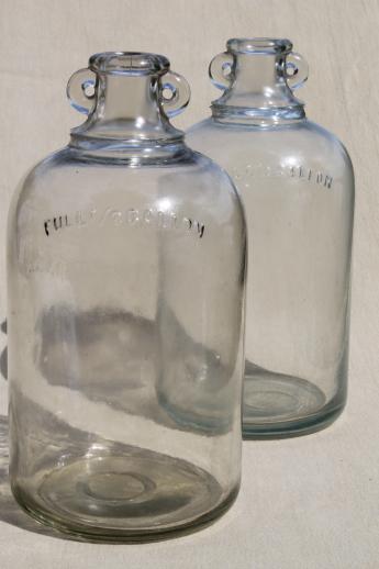 photo of vintage glass jugs, primitive half gallon jug bottles w/ ears for bail handles #1