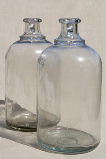 photo of vintage glass jugs, primitive half gallon jug bottles w/ ears for bail handles #3