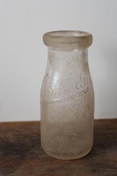 catalog photo of vintage glass milk bottle embossed for the Kennedy dairy, Madison Wisconsin 