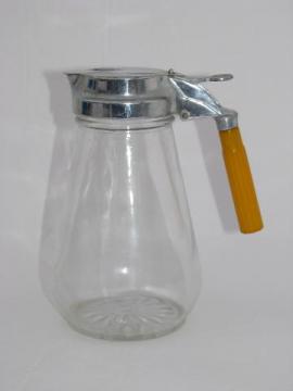 catalog photo of vintage glass syrup pitcher, carmel bakelite handle