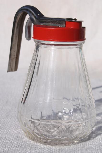 photo of vintage glass syrup pitcher w/ dripcut type metal trigger, red plastic lid #1