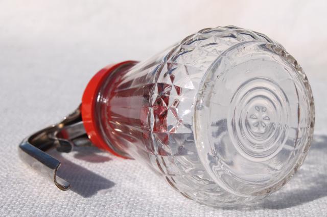photo of vintage glass syrup pitcher w/ dripcut type metal trigger, red plastic lid #7