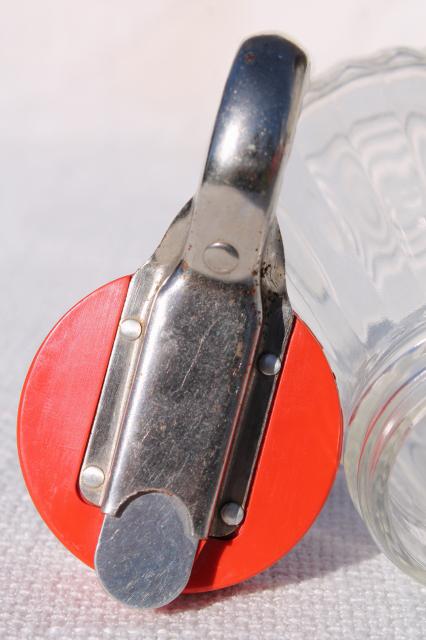 photo of vintage glass syrup pitcher w/ dripcut type metal trigger, red plastic lid #8
