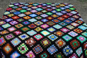 catalog photo of vintage granny squares crochet afghan, black w/ bright rainbow colors, grandmacore, so retro! 